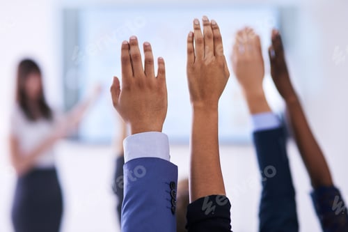 Preview: They have all the answers. Shot of a group of people raising their hands in a class.