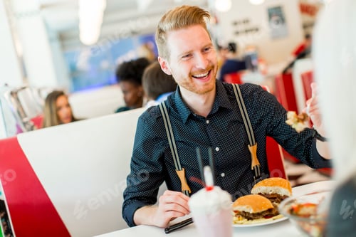Preview: Man eating in the diner