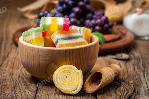 Preview: Colorful jelly candies in wooden bowl.