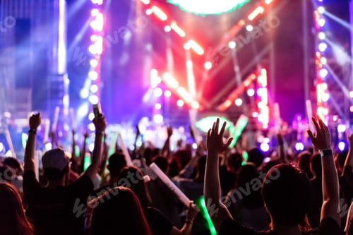 Preview: Crowd of concert stage lights and people fan audience silhouette raising hands or glow stick holding
