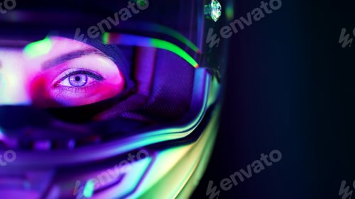 Preview: Young female motorcyclist woman in closed motorcycle helmet. Driver biker looking to camera