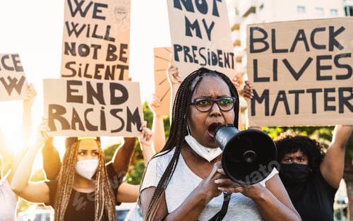 Passionate Protesters with Signs and Megaphone Outdoors