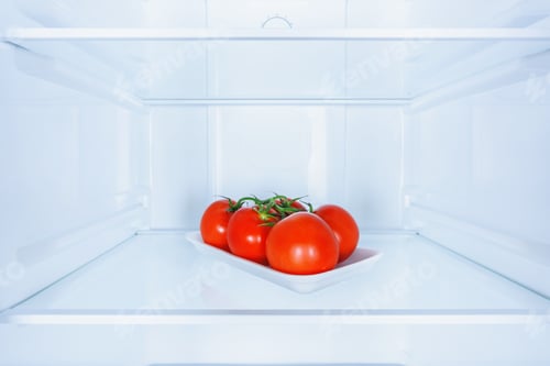 Preview: ripe red tasty tomatoes in fridge