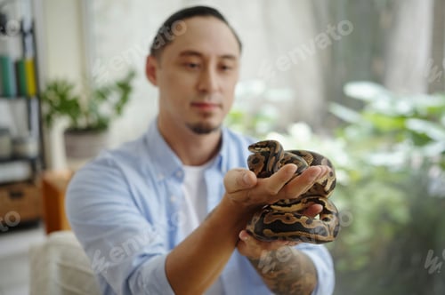 Preview: Man Holding Python in Living Room Setting