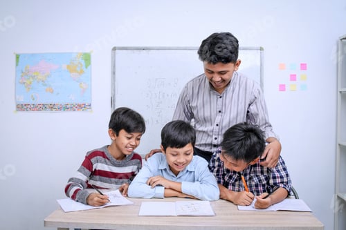 Preview: Teacher tutoring multiracial students to read at the classroo