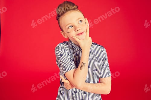 Preview: Portrait of brunette girl on red background.