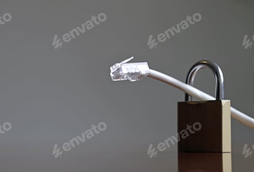 Preview: Selective focus of a LAN cable in a padlock on a gray background - concept of internet security