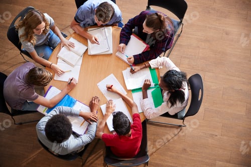 Preview: Overhead Shot Of High School Pupils In Group Study Around Tables