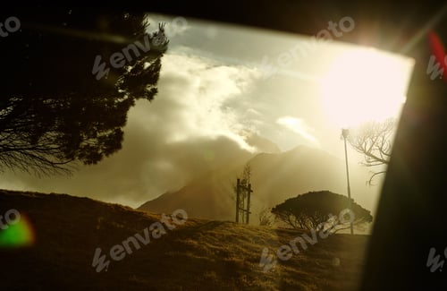 Preview: The beauty of nature. A sunset behind cloudy mountains.
