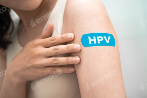 Preview: HPV, Human papillomavirus, Asian young woman receiving vaccine with blue bandage.
