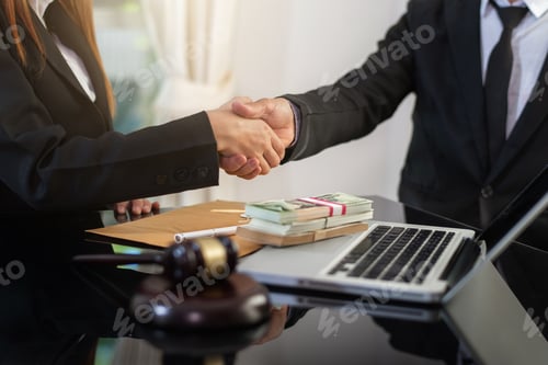 Preview: Business negotiation concept; Business people handshaking to sign contract.