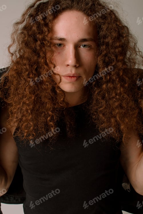 Preview: Attractive And Stylish Guy With Curly Hair And A Sports Figure