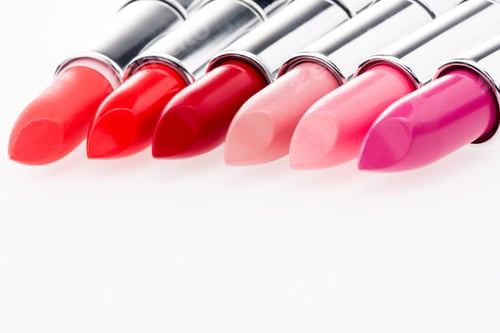 Preview: Close-up view of fashionable lipsticks set isolated on white