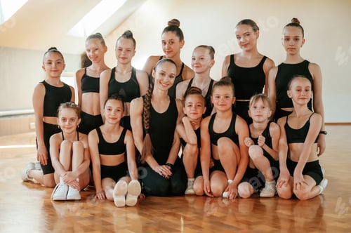 Preview: Group of young female athletes are posing in the gym