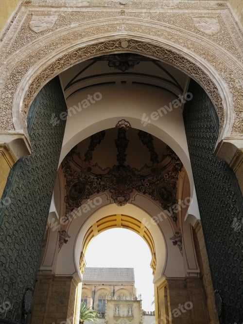 Preview: Low angle shot of the arches of a historic building in Cordoba, Spain