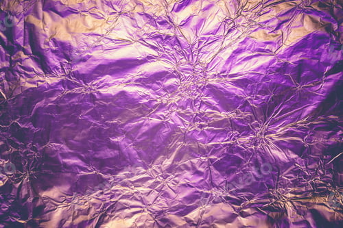 Preview: Violet deformed background made of illuminated foil. Trendy duotone texture