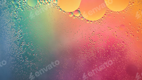 Preview: Abstract yellow, green and pink colorful background with oil on water surface. Oil drops in water
