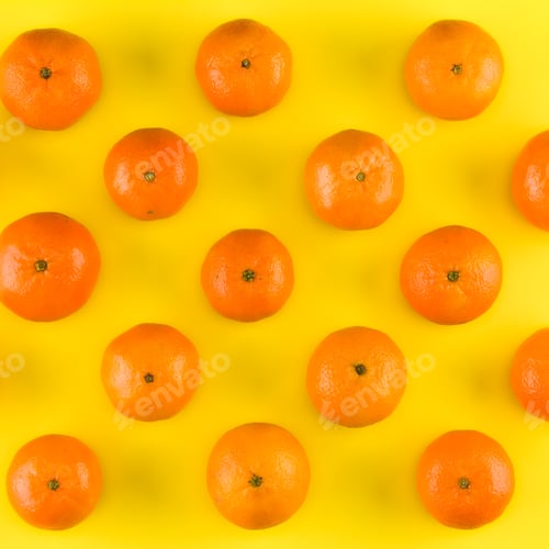 Preview: Fruit pattern of mandarin isolated on yellow background. Tangerine. Flat lay, top view.