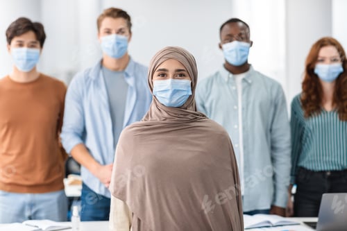 Preview: Diverse group of international people wearing medical protective face masks