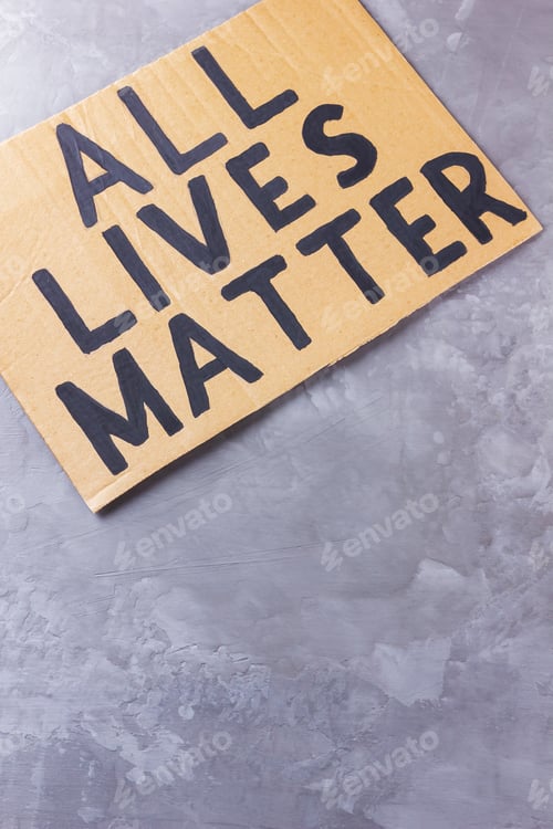 Preview: All Lives Matter. Anti Racism Concept On A Gray Background. Equal Symbol. Inscription On Cardboard