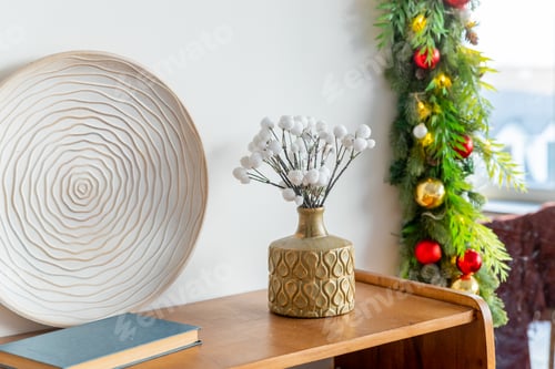 Preview: Christmas Scandinavian interior. Cozy winter interior.many branches in vase on table with old books