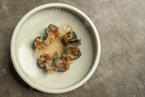 Preview: High angle shot of fusion food with sushi and seasonings in a plate on a wooden surface