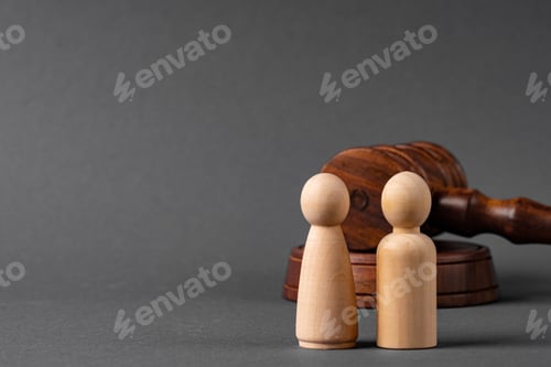 Preview: Wooden toy family and judge mallet. Family divorce concept