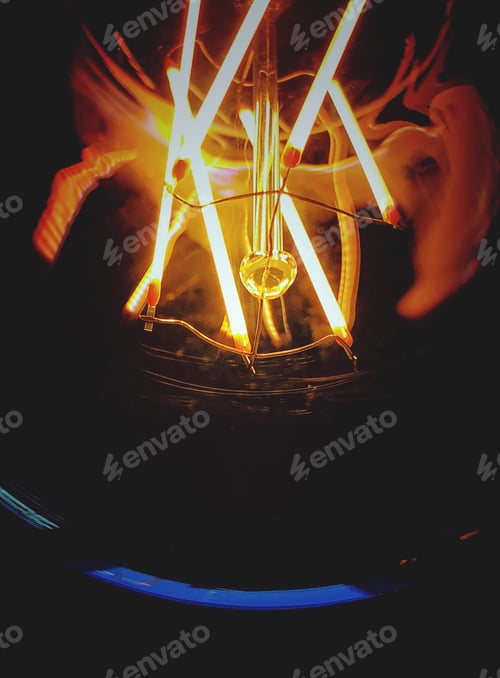 Preview: Macro Image of Lit Lightbulb Filament and Interior