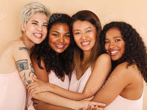 Preview: Four smiling diverse women embracing each other. Group of happy females of different races.