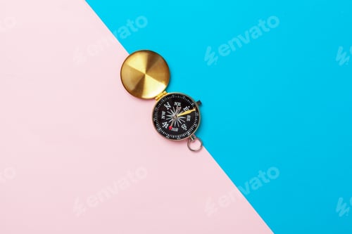 Preview: Compass on pink background, top view
