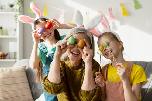 Preview: Grandmother and Granddaughters holding Easter Eggs over their Eyes
