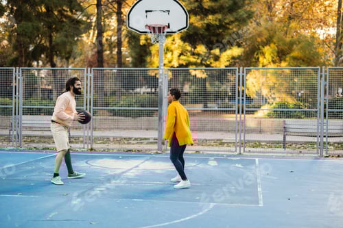Preview: Couple Playing Basketball on Outdoor Court