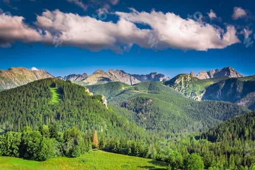 Preview: Lush Green Mountain Range and Dramatic Sky