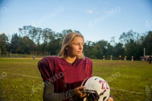 Preview: Teenage female football player on field