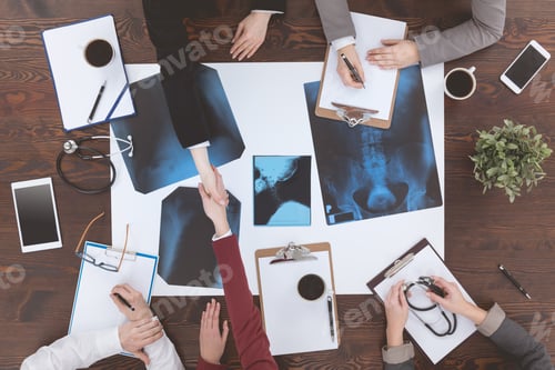Preview: Doctors shaking hands at a medical conference