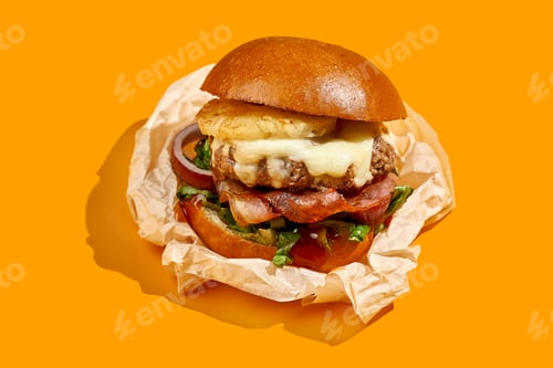 Preview: Appetizing burger with pineapple and cheese, bacon on a yellow background