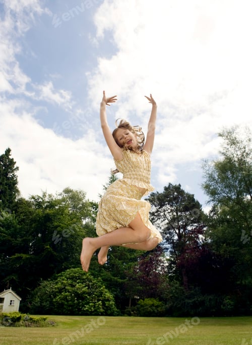 Preview: Girl jumping in garden