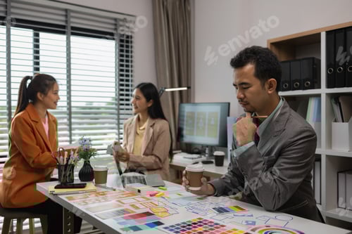 Preview: Professionals Collaborate on Mobile App Design in Office