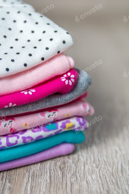 Preview: Fabric Sewing. Folded pink and white bodysuit