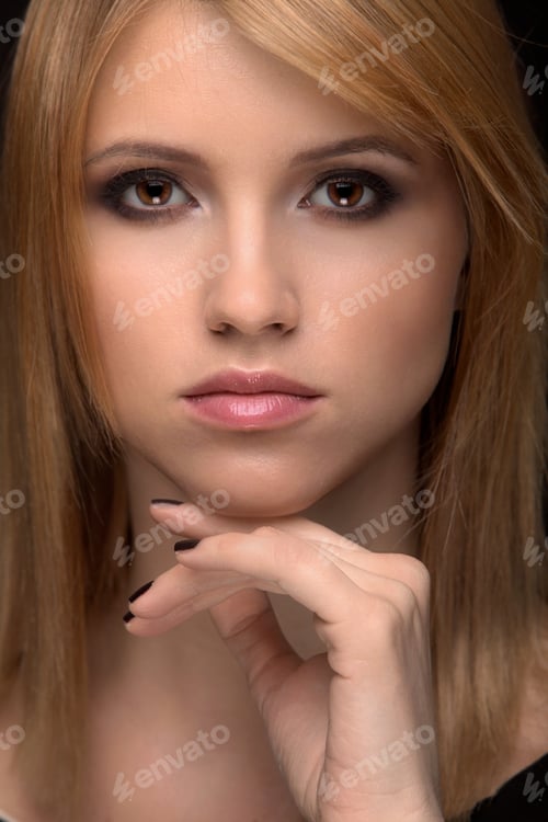 Preview: Elegant Young Woman Posing with Hand Near Face