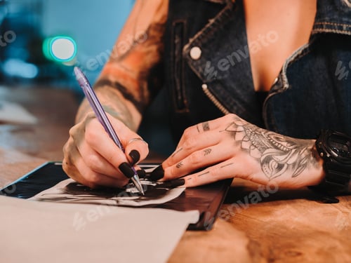 Preview: Tattoo artist drawing illustration inside ink studio