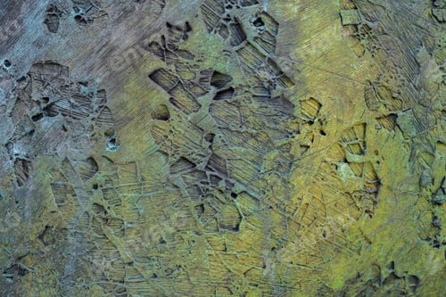 Preview: background of a rusty metallic rough surface with ocher colors and trace patterns.