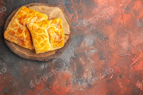 Preview: top view penovani khachapuri on wood board on dark red background free space