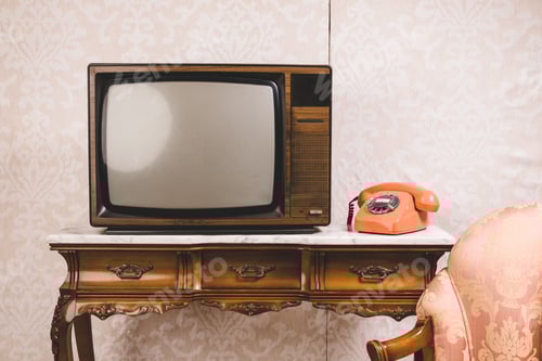 Preview: Old tv and telephone in an interior place with decoration in retro style.