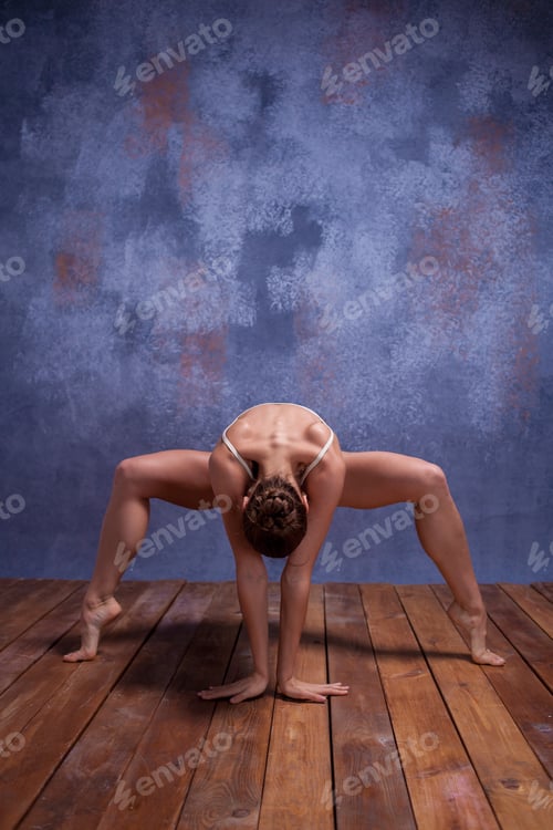 Preview: Young Beautiful Dancer In Beige Swimwear Dancing On Lilac Studio Background On Wooden Floor