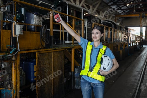 Preview: Portrait of Engineer train Inspect the train's diesel engine, railway track in depot of train