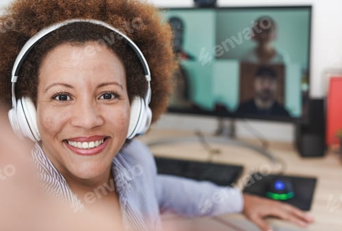 Preview: Multiracial mature woman taking a selfie with video call people in background