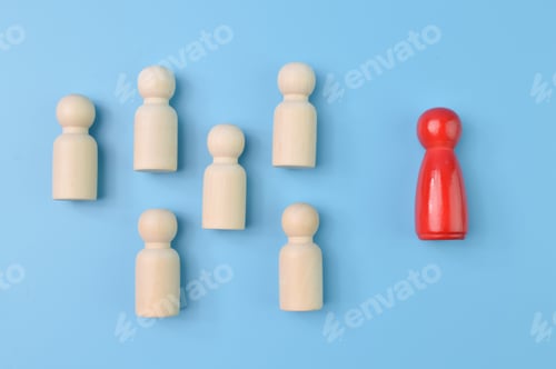 Preview: A red wooden people figure standing with a team to influence and empowerment. Leadership, talented