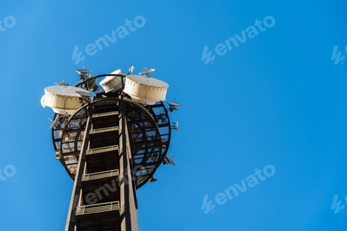 Preview: Large telecommunications tower full of radio and television broadcast antennas.
