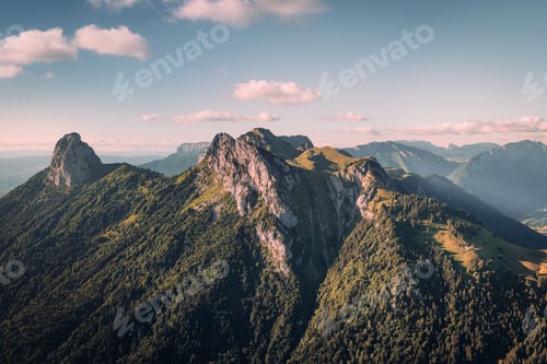 Preview: Mountains of Annecy in the French Alps under blue sky with white fluffy clouds
